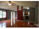 Open-concept living room with hardwood floors adjacent to the kitchen and dining areas at 9109 Foggy Meadow Rd, Charlotte, NC 28269