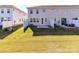 A well-maintained backyard with a small patio area and a white fence, perfect for outdoor relaxation and entertaining at 9134 Northfield Crossing Dr, Charlotte, NC 28269