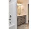 Bathroom features a neutral vanity with lighting and bath with shower at 9134 Northfield Crossing Dr, Charlotte, NC 28269