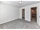 Bedroom with closet and view to hallway upstairs with banister at 9134 Northfield Crossing Dr, Charlotte, NC 28269