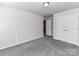 Bedroom with closet and doors and plush neutral carpeting at 9134 Northfield Crossing Dr, Charlotte, NC 28269