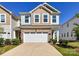 Charming two-story home with a stone accent garage, neutral siding, and well-manicured landscaping at 9134 Northfield Crossing Dr, Charlotte, NC 28269