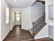 Inviting foyer with wood flooring, a staircase, and neutral paint, creating a warm entrance at 9134 Northfield Crossing Dr, Charlotte, NC 28269