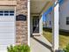 Welcoming front porch with stone accents, white pillars, and clear signage for the home's address at 9134 Northfield Crossing Dr, Charlotte, NC 28269