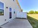 Back of home and patio with view of small fenced-in yard at 9134 Northfield Crossing Dr, Charlotte, NC 28269