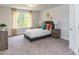 Comfortable bedroom with natural light, neutral walls, and soft carpeting at 1015 Gardenia Dr # 52, Mt Ulla, NC 28125
