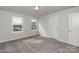 Comfortable bedroom with plush carpet, natural light, and neutral walls at 1015 Gardenia Dr # 52, Mt Ulla, NC 28125