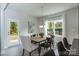 Dining room featuring natural light, modern furnishings, and a view to an outdoor area at 1015 Gardenia Dr # 52, Mt Ulla, NC 28125