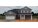 Charming two-story home with a two-car garage and covered front porch at 1015 Gardenia Dr # 52, Mt Ulla, NC 28125