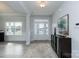 Bright foyer with a decorative rug, console table, and neutral walls that lead to a window filled living space at 1015 Gardenia Dr # 52, Mt Ulla, NC 28125