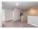Upstairs hallway with cozy carpet, natural light, and neutral walls at 1015 Gardenia Dr # 52, Mt Ulla, NC 28125