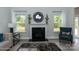 Inviting living room with fireplace, natural light, and cozy seating at 1015 Gardenia Dr # 52, Mt Ulla, NC 28125