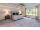 Serene main bedroom with tray ceiling, large window, and neutral tones at 1015 Gardenia Dr # 52, Mt Ulla, NC 28125