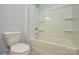 Bathroom featuring a toilet and a shower-tub combo, perfect for relaxing at 10209 Meeting House Nw Dr, Huntersville, NC 28078