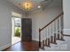 Inviting entryway with hardwood floors and a staircase leading to the upper level at 10209 Meeting House Nw Dr, Huntersville, NC 28078