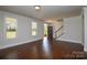 Bright living room showcases hardwood floors, large windows, and an open floor plan at 10209 Meeting House Nw Dr, Huntersville, NC 28078