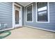 Patio featuring a sliding glass door and two windows, providing natural light and outdoor access at 10209 Meeting House Nw Dr, Huntersville, NC 28078