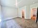 Bedroom features carpet and an open door to a walk-in closet at 1035 Gardenia Dr # 51, Mt Ulla, NC 28125