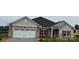 Charming single-story home with stone accents, attached garage, and well-manicured lawn at 1035 Gardenia Dr # 51, Mt Ulla, NC 28125