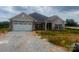 Charming single Gathering home with a two-car garage, stone accents and durable gray siding at 1035 Gardenia Dr # 51, Mt Ulla, NC 28125