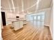 Spacious open-concept kitchen with a large island and stainless steel appliances at 1035 Gardenia Dr # 51, Mt Ulla, NC 28125