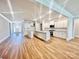 Modern kitchen with stainless steel appliances, a center island, white cabinets, and granite countertops at 1035 Gardenia Dr # 51, Mt Ulla, NC 28125