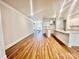 Open concept living area with wood-look flooring that connects to the kitchen at 1035 Gardenia Dr # 51, Mt Ulla, NC 28125