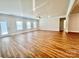 Large living room featuring wood floors, and a door leading to the back yard at 1035 Gardenia Dr # 51, Mt Ulla, NC 28125