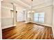 Bright and open living room with hardwood floors, neutral walls, and large windows at 1035 Gardenia Dr # 51, Mt Ulla, NC 28125