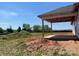 An open, covered patio featuring wooden supports and a concrete floor at 1035 Gardenia Dr # 51, Mt Ulla, NC 28125