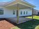 A partially covered patio extends from the rear of the house, ideal for outdoor dining and relaxing at 1050 Gardenia Dr # 3, Mt Ulla, NC 28125