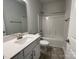 Clean bathroom featuring a white vanity, shower over tub and modern fixtures at 1050 Gardenia Dr # 3, Mt Ulla, NC 28125
