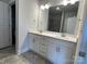 Modern bathroom featuring a double sink vanity with white cabinets and stone countertops at 1050 Gardenia Dr # 3, Mt Ulla, NC 28125
