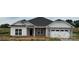 Charming single-story home with stone accents, a two-car garage, and well-manicured lawn at 1050 Gardenia Dr # 3, Mt Ulla, NC 28125