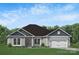 Charming single-story home featuring a well-maintained lawn, covered entrance, and attached two-car garage at 1050 Gardenia Dr # 3, Mt Ulla, NC 28125