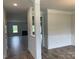 Elegant foyer showcasing detailed molding, hardwood floors, and an open view into the spacious living area at 1050 Gardenia Dr # 3, Mt Ulla, NC 28125