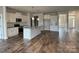 Well-lit kitchen boasts sleek countertops, modern appliances, and ample storage space in pristine white cabinetry at 1050 Gardenia Dr # 3, Mt Ulla, NC 28125