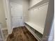 Well-organized mudroom with a built-in bench, cubbies, and hooks for storage and convenience at 1050 Gardenia Dr # 3, Mt Ulla, NC 28125