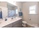 Bathroom features a marble countertop and modern fixtures with a window at 1070 Gardenia Dr # 4, Mt Ulla, NC 28125