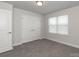 Bedroom boasts carpet flooring, natural light, and a closet for ample storage at 1070 Gardenia Dr # 4, Mt Ulla, NC 28125