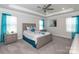 Bright primary bedroom boasts tray ceilings, soft carpet flooring, and ample natural light for a serene ambiance at 1070 Gardenia Dr # 4, Mt Ulla, NC 28125