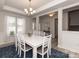 Elegant dining room with a white table, stylish decor, and a modern chandelier at 1070 Gardenia Dr # 4, Mt Ulla, NC 28125