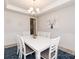 Elegant dining room with a white table, stylish decor, and a modern chandelier at 1070 Gardenia Dr # 4, Mt Ulla, NC 28125