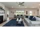 Bright living room features a fireplace, large windows and neutral decor at 1070 Gardenia Dr # 4, Mt Ulla, NC 28125