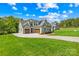 Charming home featuring a well-maintained lawn and inviting driveway at 108 Castleview Ln, Mooresville, NC 28115