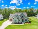 Attractive home with a manicured lawn and convenient two-car garage at 108 Castleview Ln, Mooresville, NC 28115