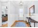 Bright foyer with hardwood floors, wainscotting, and elegant lighting at 108 Castleview Ln, Mooresville, NC 28115