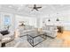 Open-concept living space includes living room, dining area, and kitchen with a central island at 108 Castleview Ln, Mooresville, NC 28115