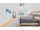 Sunlit main bedroom featuring hardwood floors, and a serene, neutral color palette at 108 Castleview Ln, Mooresville, NC 28115