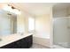 Bathroom featuring a bathtub, shower, and large mirror at 1121 Thoroughbred Nw Pl, Concord, NC 28027